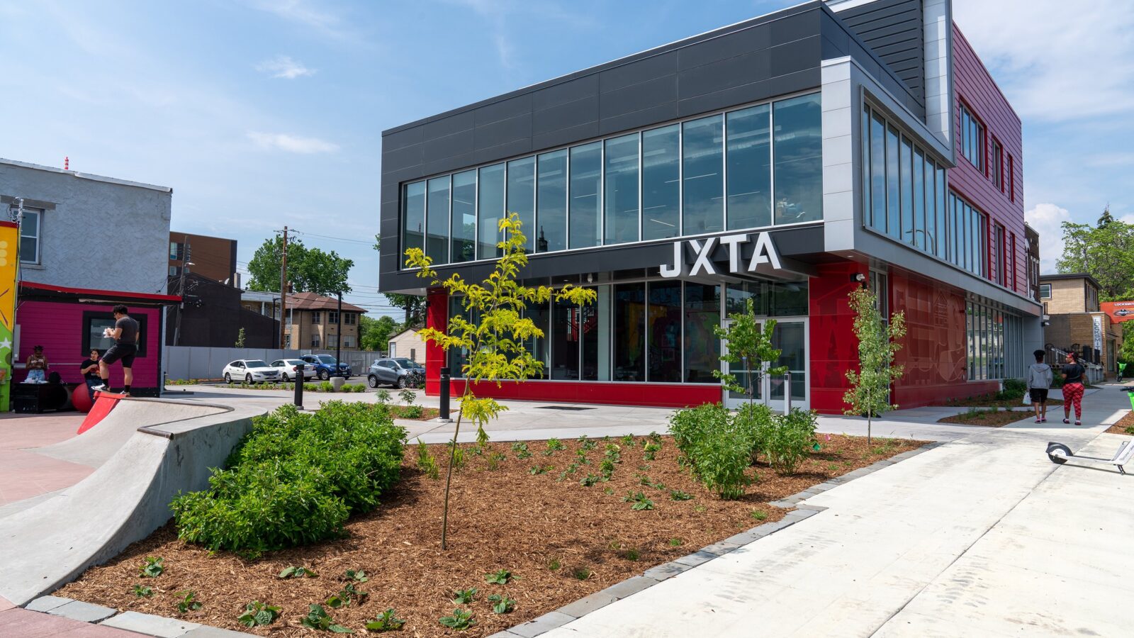 A red and silver building labeled JXTA