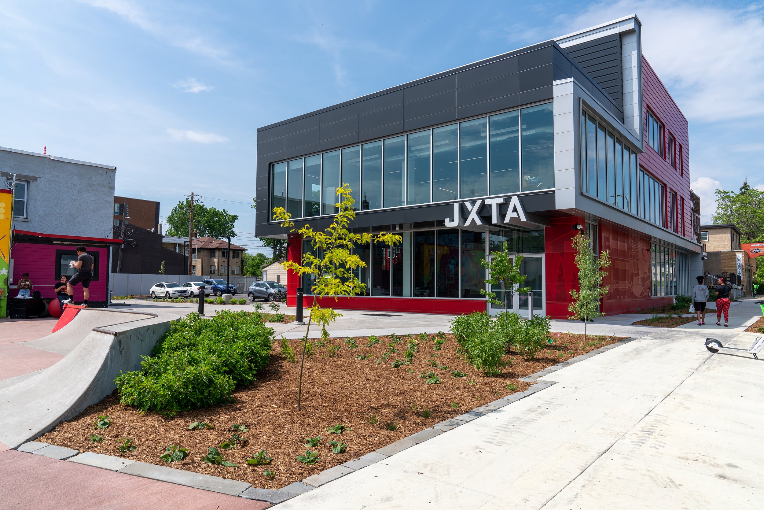 A red and silver building labeled JXTA